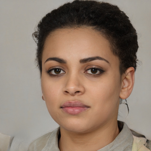 Neutral latino young-adult female with short  black hair and brown eyes