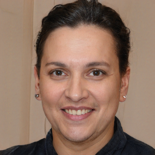 Joyful white adult female with short  brown hair and brown eyes