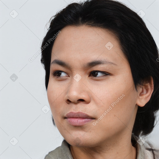 Joyful asian young-adult female with medium  black hair and brown eyes