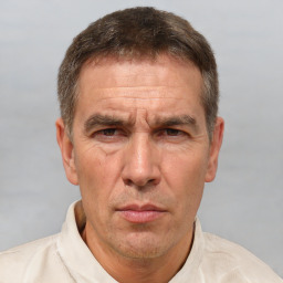 Neutral white middle-aged male with short  brown hair and brown eyes