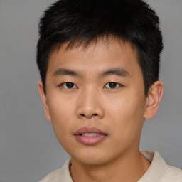 Neutral asian young-adult male with short  brown hair and brown eyes