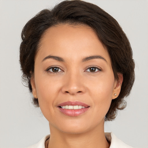 Joyful white young-adult female with medium  brown hair and brown eyes