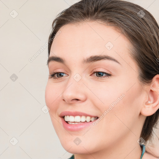 Joyful white young-adult female with medium  brown hair and blue eyes