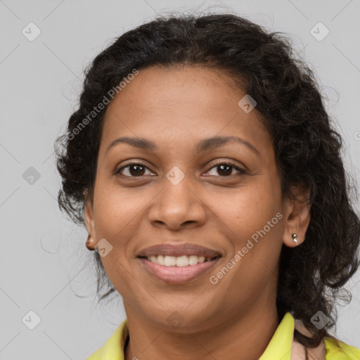 Joyful latino adult female with medium  brown hair and brown eyes