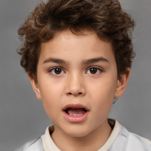 Joyful white child male with short  brown hair and brown eyes