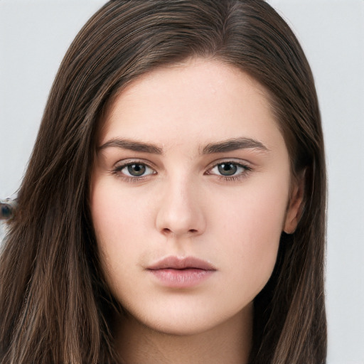 Neutral white young-adult female with long  brown hair and brown eyes