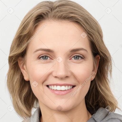 Joyful white young-adult female with medium  brown hair and blue eyes