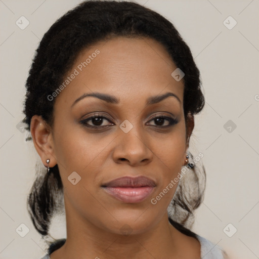 Joyful black young-adult female with medium  brown hair and brown eyes