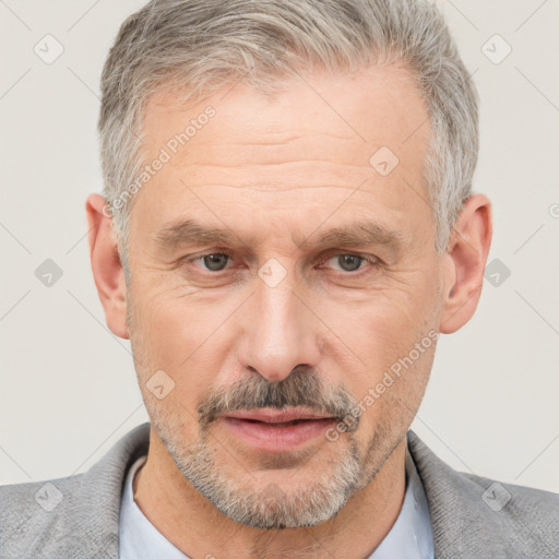 Neutral white middle-aged male with short  gray hair and brown eyes