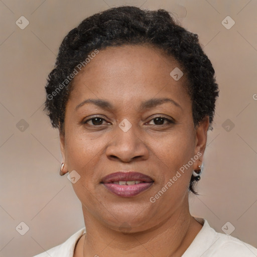 Joyful black adult female with short  brown hair and brown eyes