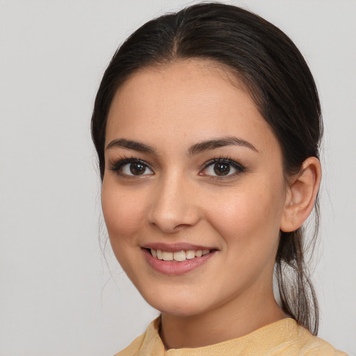 Joyful white young-adult female with medium  brown hair and brown eyes