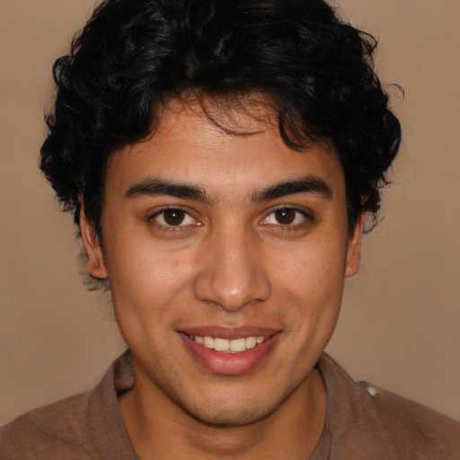 Joyful latino young-adult male with short  brown hair and brown eyes