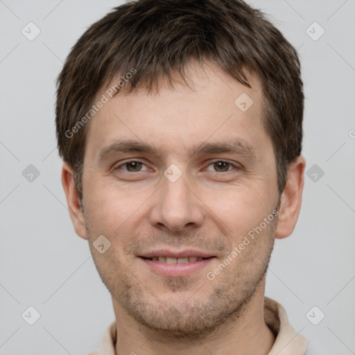 Joyful white young-adult male with short  brown hair and brown eyes