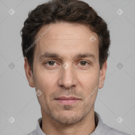 Joyful white adult male with short  brown hair and grey eyes