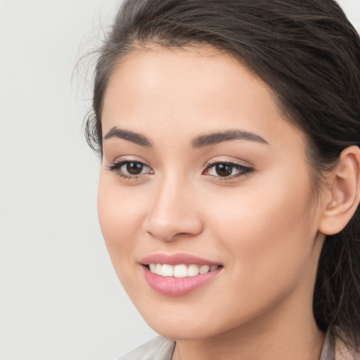 Joyful white young-adult female with long  brown hair and brown eyes