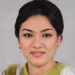 Joyful asian young-adult female with short  brown hair and brown eyes