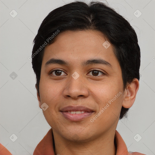 Joyful asian young-adult male with short  brown hair and brown eyes