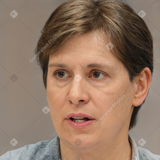 Joyful white adult female with short  brown hair and brown eyes