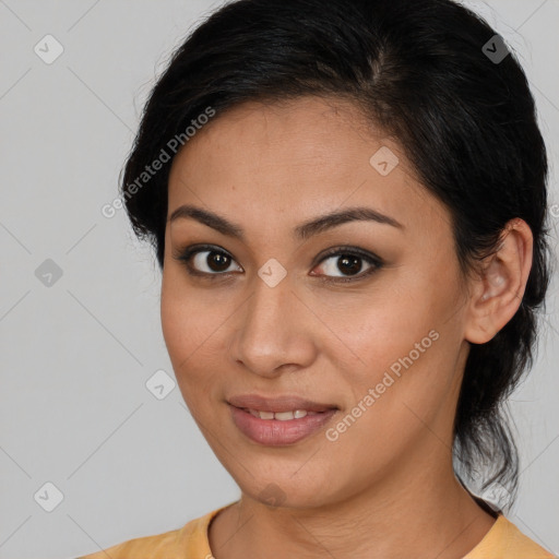 Joyful latino young-adult female with medium  brown hair and brown eyes