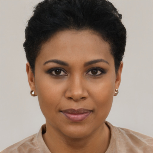 Joyful latino young-adult female with short  black hair and brown eyes