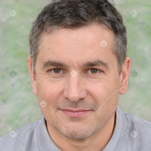 Joyful white adult male with short  brown hair and brown eyes