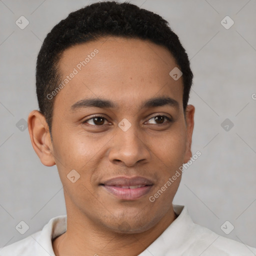 Joyful latino young-adult male with short  brown hair and brown eyes