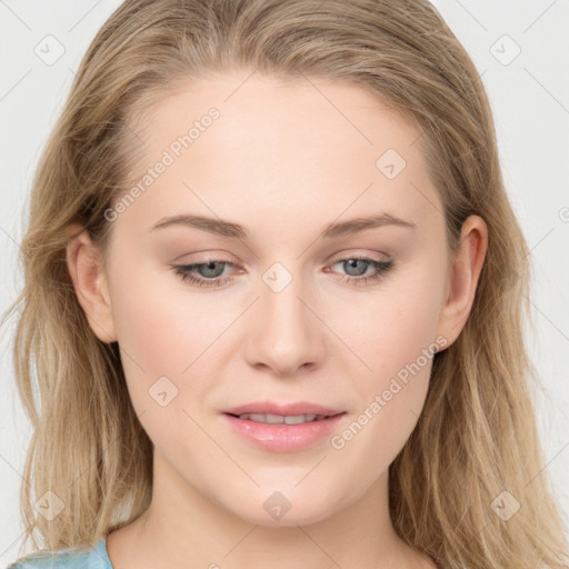 Joyful white young-adult female with long  brown hair and blue eyes