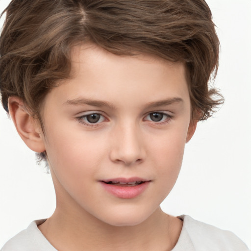 Joyful white child male with short  brown hair and brown eyes