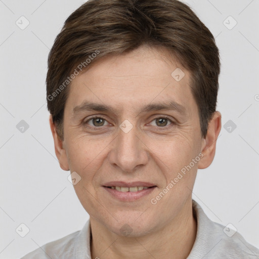 Joyful white adult male with short  brown hair and grey eyes