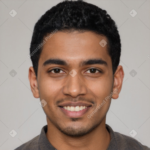 Joyful latino young-adult male with short  black hair and brown eyes