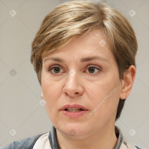 Joyful white adult female with medium  brown hair and grey eyes