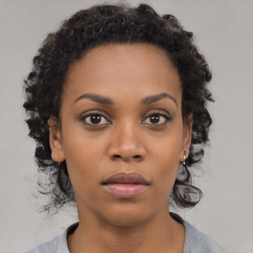 Neutral black young-adult female with medium  black hair and brown eyes