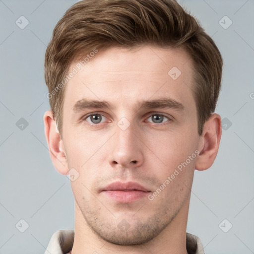 Neutral white young-adult male with short  brown hair and grey eyes