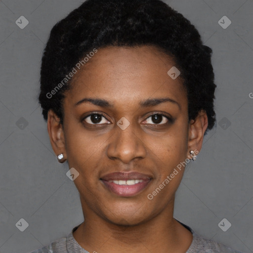 Joyful black young-adult female with short  black hair and brown eyes