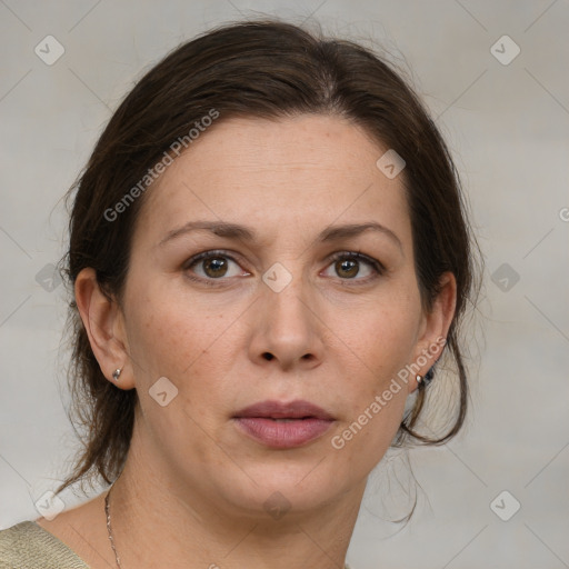 Joyful white adult female with medium  brown hair and grey eyes