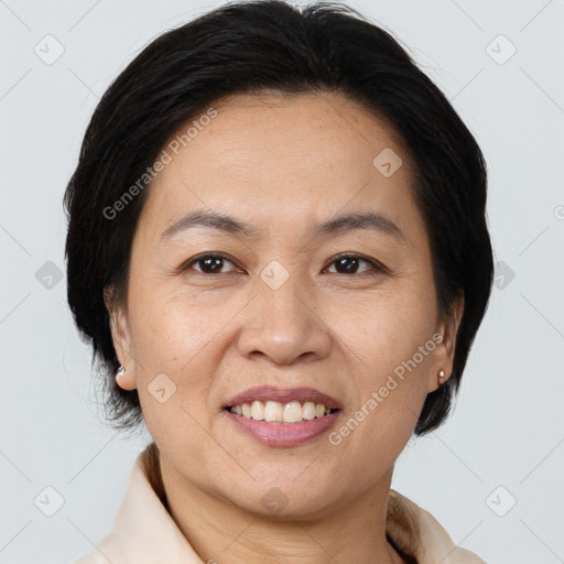 Joyful white adult female with medium  brown hair and brown eyes