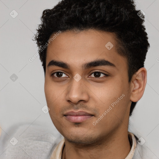 Neutral latino young-adult male with short  black hair and brown eyes