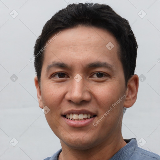 Joyful asian young-adult male with short  black hair and brown eyes