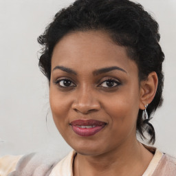 Joyful black young-adult female with medium  brown hair and brown eyes