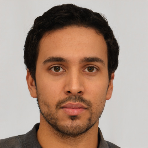 Neutral latino young-adult male with short  black hair and brown eyes