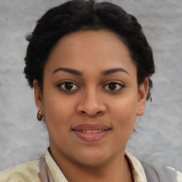 Joyful latino young-adult female with short  brown hair and brown eyes