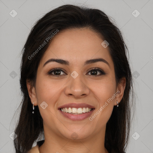 Joyful latino young-adult female with long  brown hair and brown eyes