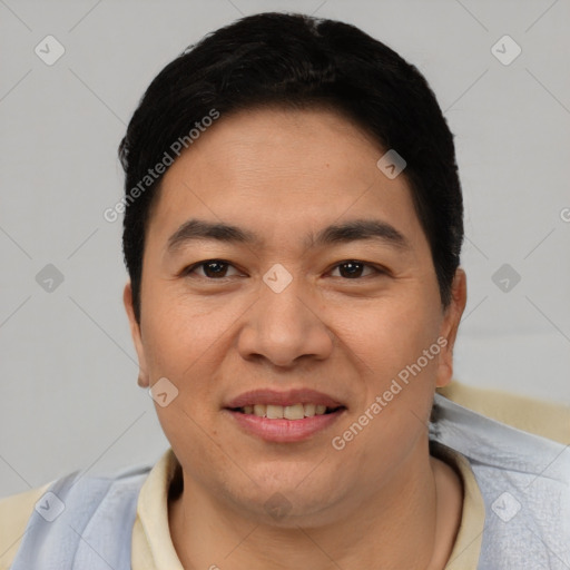 Joyful asian young-adult male with short  black hair and brown eyes