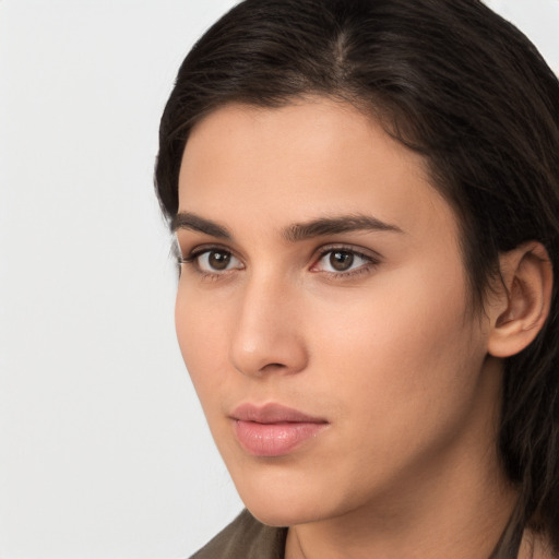 Neutral white young-adult female with long  brown hair and brown eyes