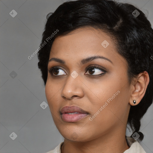 Joyful asian young-adult female with medium  black hair and brown eyes