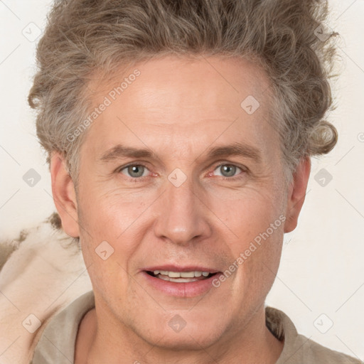 Joyful white adult male with short  brown hair and grey eyes