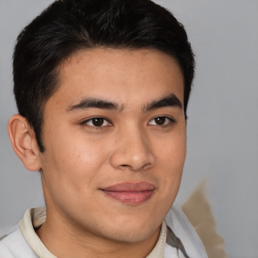 Joyful asian young-adult male with short  brown hair and brown eyes
