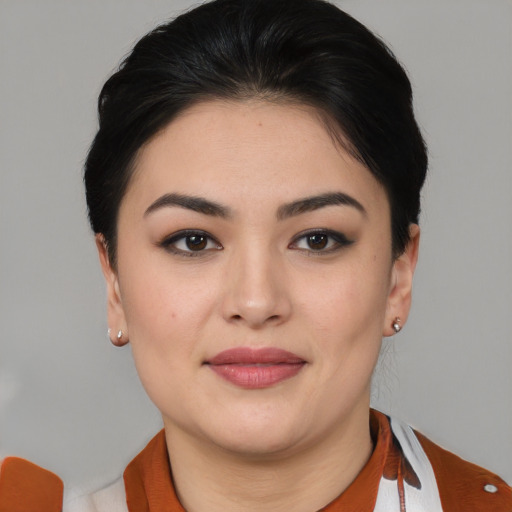 Joyful asian young-adult female with medium  brown hair and brown eyes