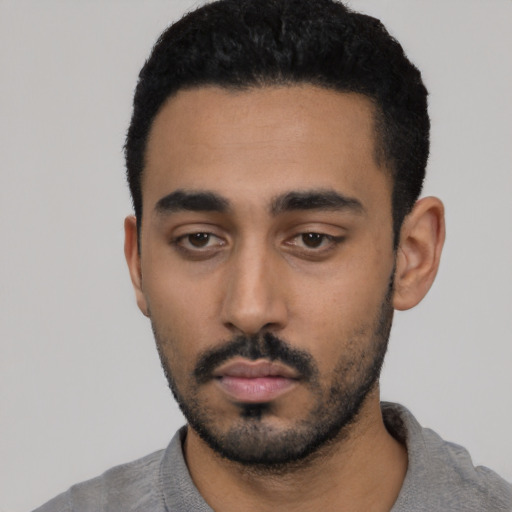 Neutral latino young-adult male with short  black hair and brown eyes