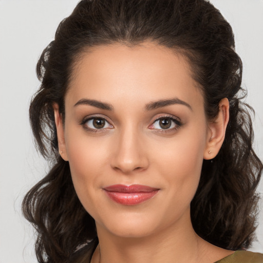 Joyful white young-adult female with medium  brown hair and brown eyes